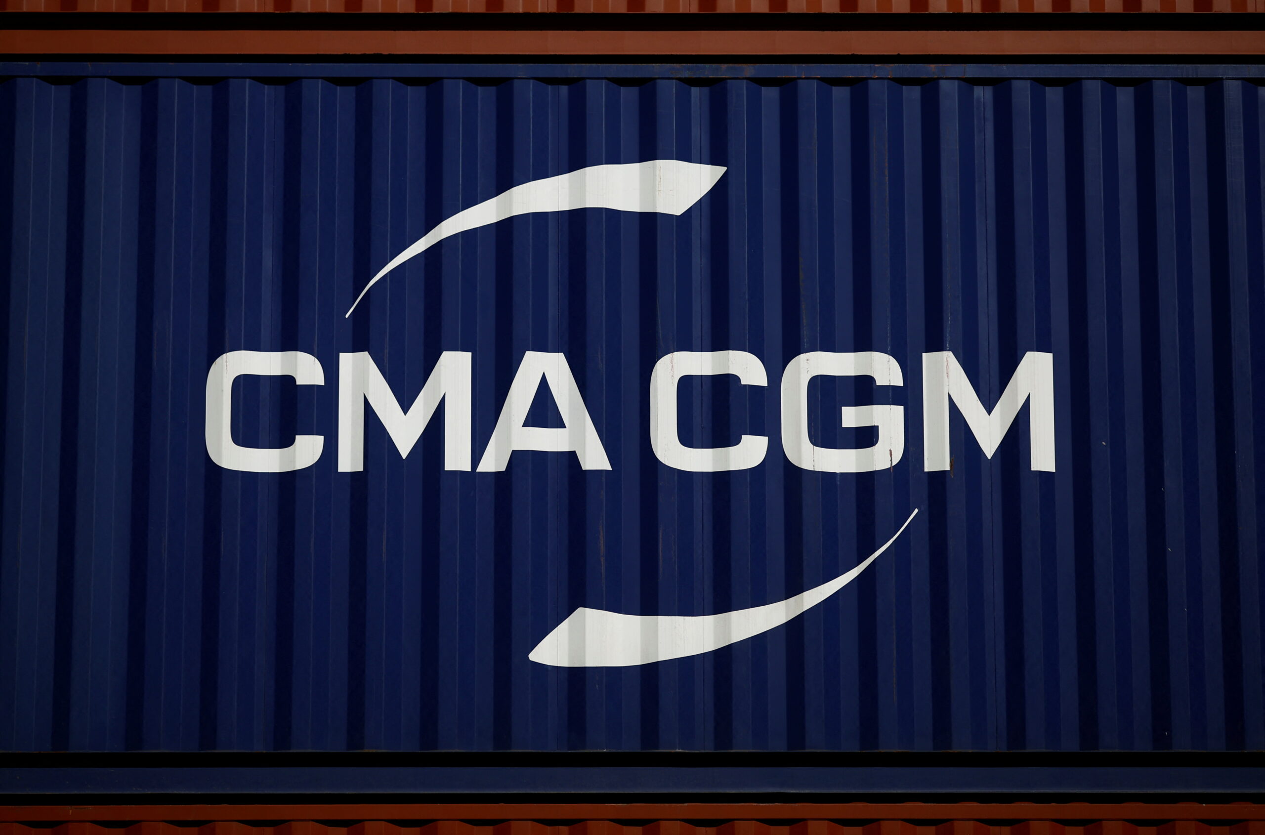 FILE PHOTO: The logo of CMA-CGM shipping company is pictured on a container in Montoir-de-Bretagne near Saint-Nazaire, France, March 4, 2022. REUTERS/Stephane Mahe